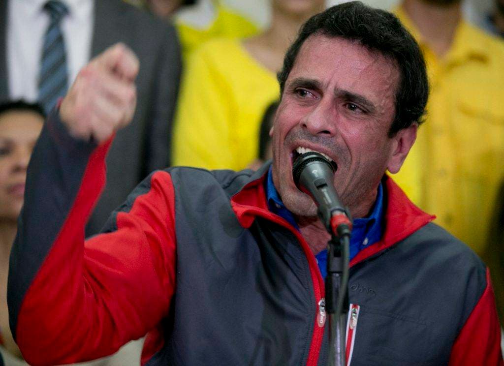 Opposition leader Henrique Capriles speaks during a press conference, in Caracas, Venezuela, Friday, Oct. 21, 2016. Venezuela's electoral authority suspended a recall drive against President Nicolas Maduro on Thursday, less than a week before it was set to start, throwing the opposition's key campaign to oust the leader into further disarray. In a related move, a court appeared to issue a ruling Friday blocking key opposition leaders, including Capriles, from leaving the country. (AP Photo/Ariana Cubillos)