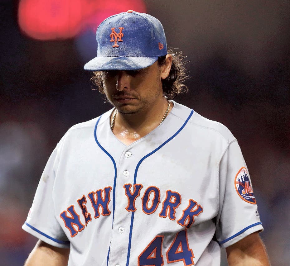 New York Mets starting pitcher Jason Vargas walks off the field after being taken out of the baseball game game during the sixth inning against the Miami Marlins on Friday, July 12, 2019, in Miami. (AP Photo/Brynn Anderson)