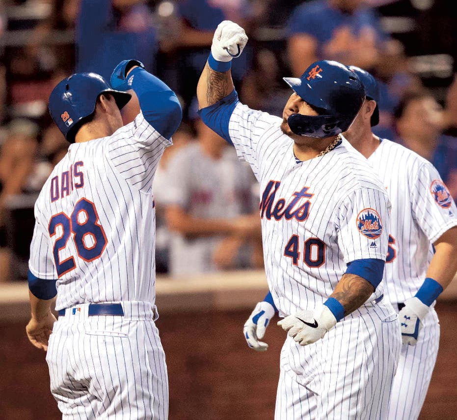 New York Mets' Wilson Ramos (40) celebrates his three-run home run with J.D. Davis (28) during the third inning of the team's baseball game against the Miami Marlins, Tuesday, Aug. 6, 2019, in New York. (AP Photo/Mary Altaffer)