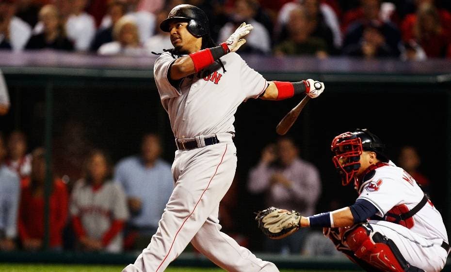 Manny Ramirez of the Boston Red Sox hits a double in the first inning against the Cleveland Indians during Game Five of the American League Championship Series at Jacobs Field 18 October 2007 in Cleveland, Ohio.   Gregory Shamus/Getty Images/AFP   == FOR NEWSPAPERS, INTERNET, TELCOS & TELEVISION USE ONLY ==