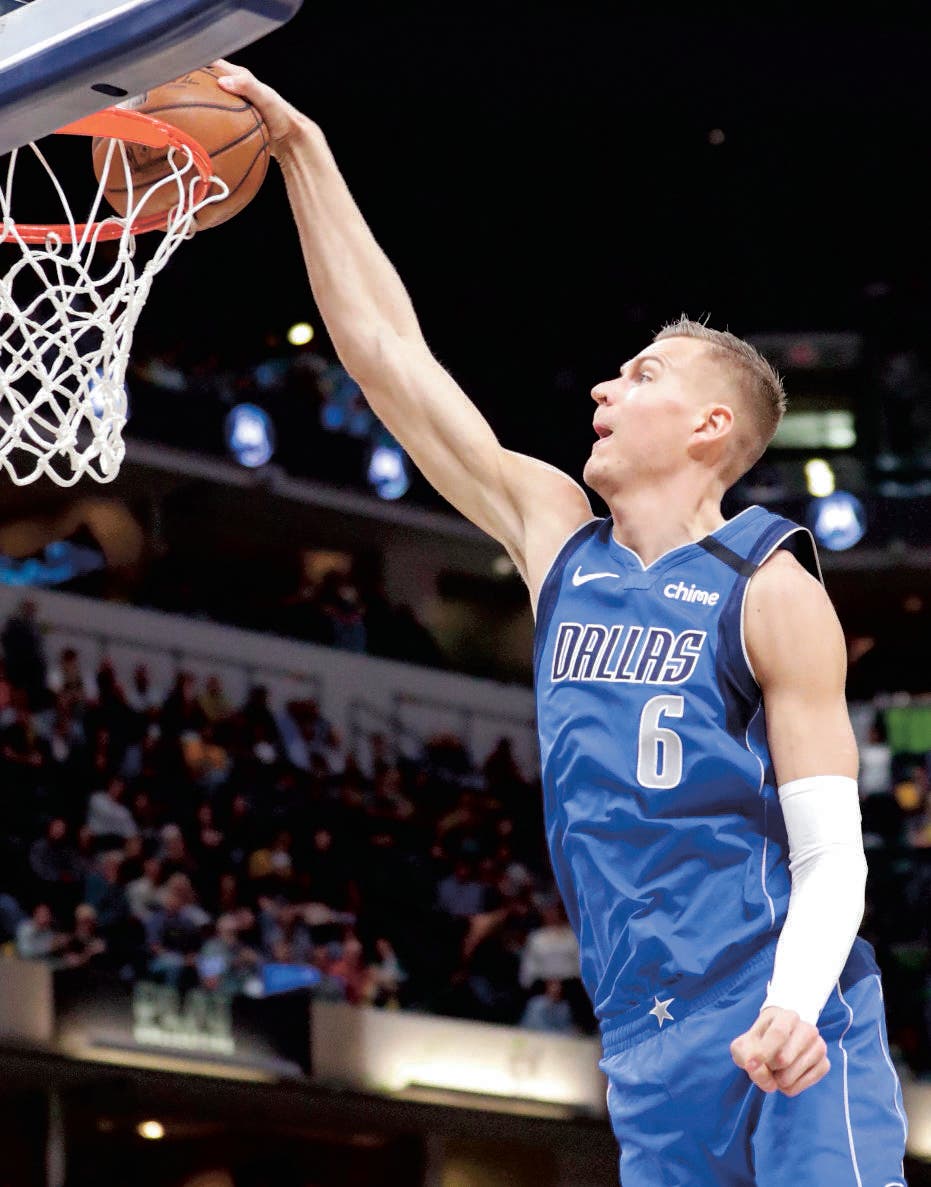 Dallas Mavericks forward Kristaps Porzingis (6) gets a dunk against the Indiana Pacers during the first half of an NBA basketball game in Indianapolis, Monday, Feb. 3, 2020. (AP Photo/Michael Conroy)