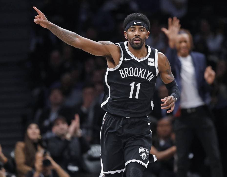 Brooklyn Nets guard Kyrie Irving (11) celebrates after scoring during the first half of the team's NBA basketball game against the Minnesota Timberwolves, Wednesday, Oct. 23, 2019, in New York. Irving had 50 points but the Nets fell to the Timberwolves in overtime, 127-126. (AP Photo/Kathy Willens)