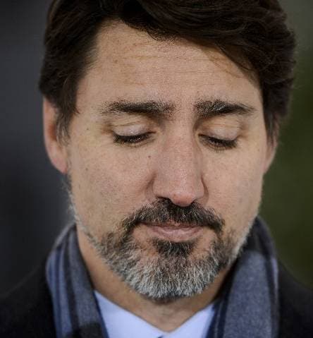 Prime Minister Justin Trudeau addresses Canadians on the COVID-19 situation from Rideau Cottage in Ottawa on Monday, March 23, 2020. Trudeau says "enough is enough. Go home and stay home."  Trudeau says staying at home is a duty and the government will enforce it if necessary. (Sean Kilpatrick/The Canadian Press via AP)