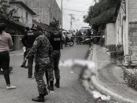 En Santiago matan seguridad de banca de lotería, roban arma y dinero